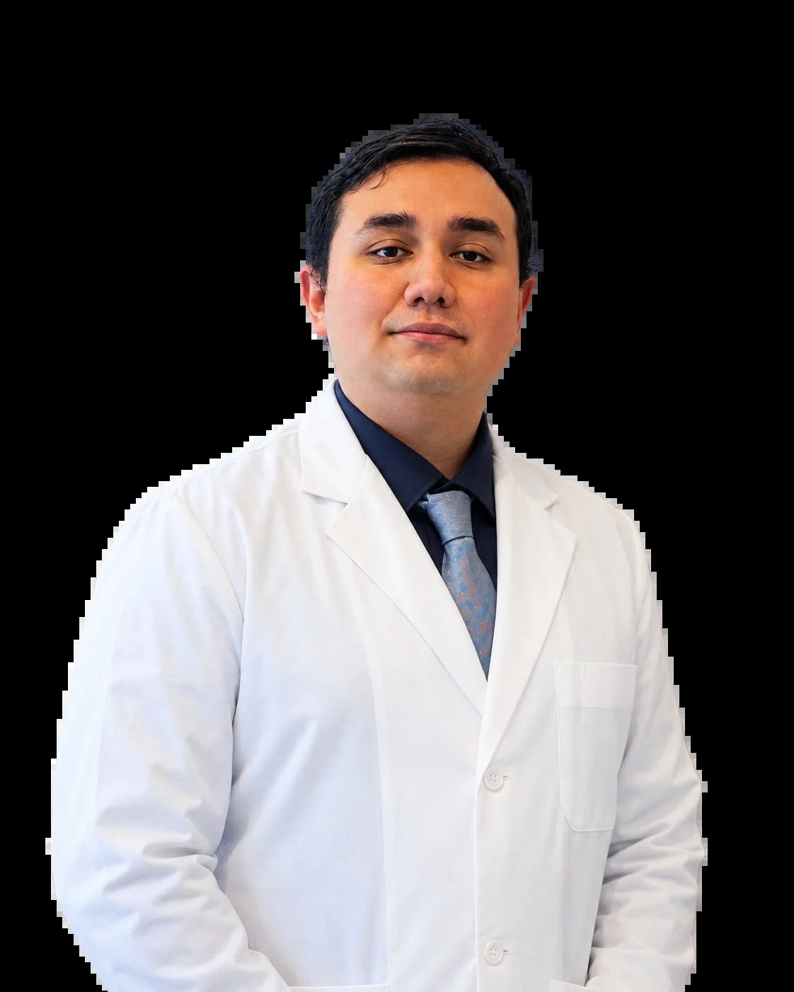 Professional headshot of a man in a white lab coat and dark shirt against a black background