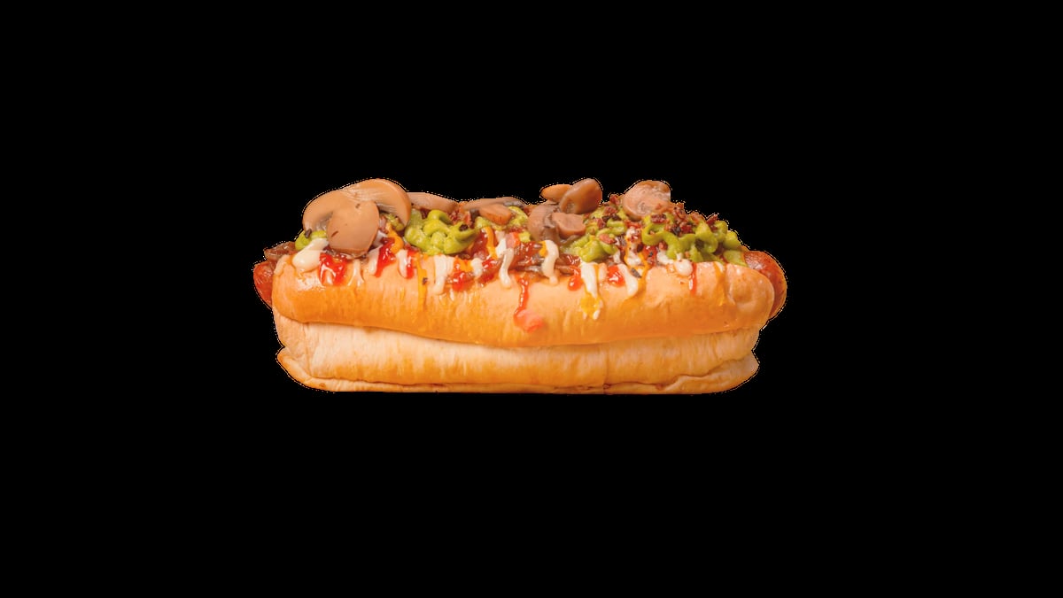 Gourmet hot dog topped with crispy onions, bacon, and cheese on a toasted bun